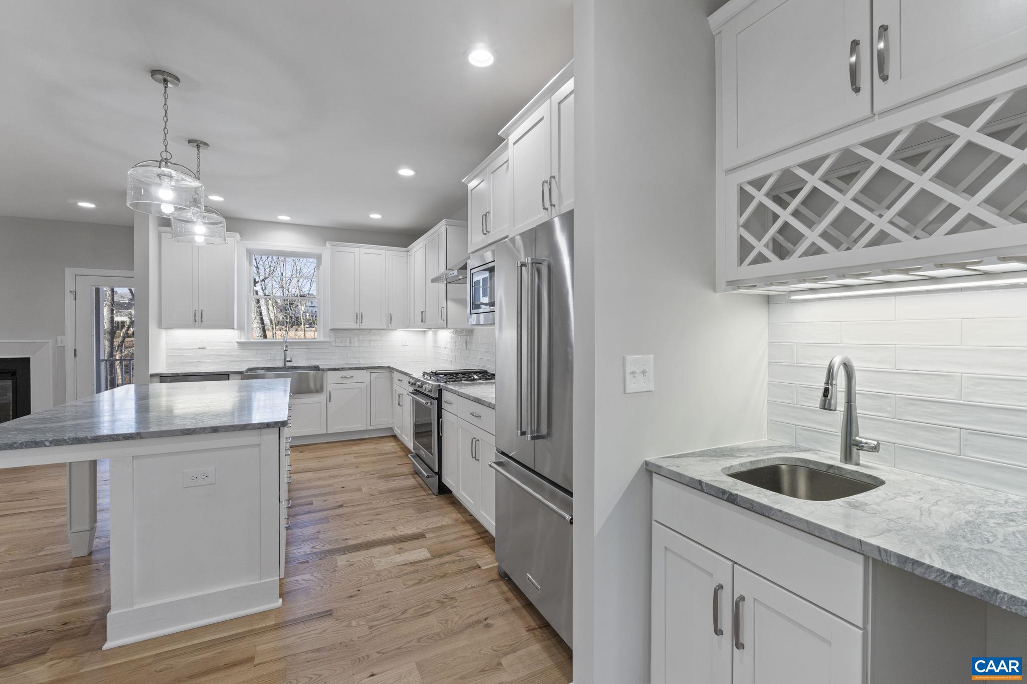 2230 Fowler Circle Charlottesville, VA 22901 - Photo 17 of 58 a kitchen with stainless steel appliances granite countertop a sink refrigerator and cabinets