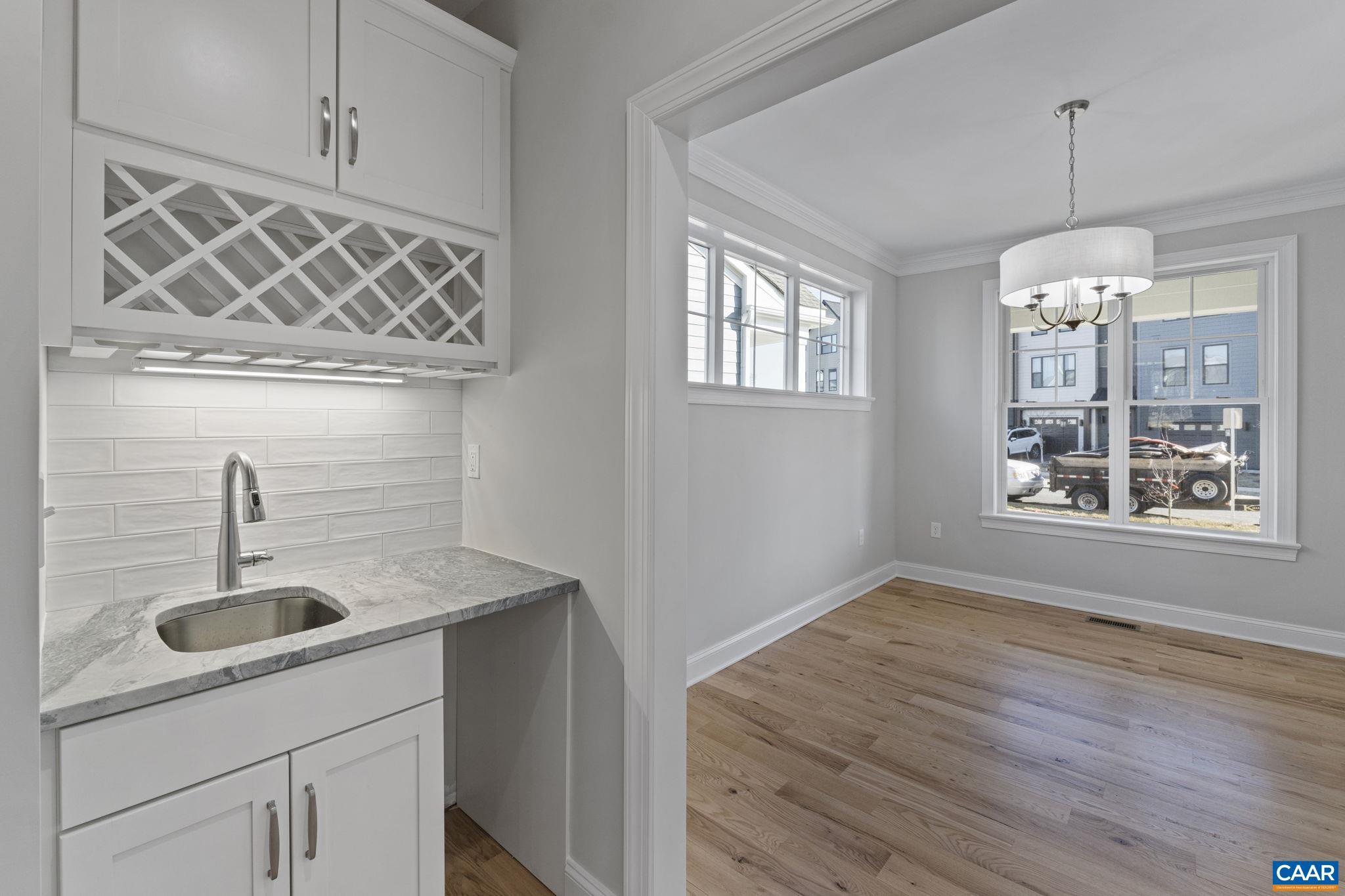2230 Fowler Circle Charlottesville, VA 22901 - Photo 18 of 58 a kitchen with a sink and chandelier
