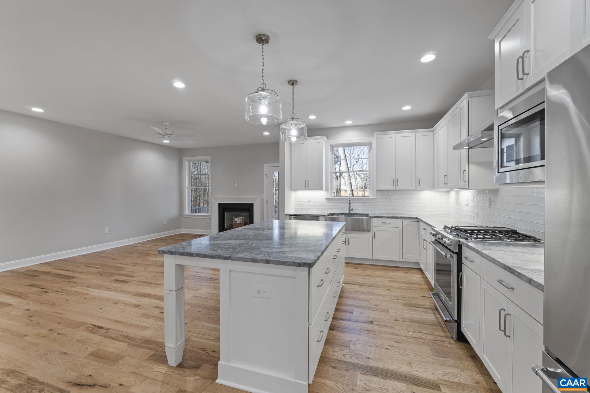 2230 Fowler Circle Charlottesville, VA 22901 - Photo 20 of 58 a kitchen with stainless steel appliances granite countertop hardwood floor sink stove and granite counter top