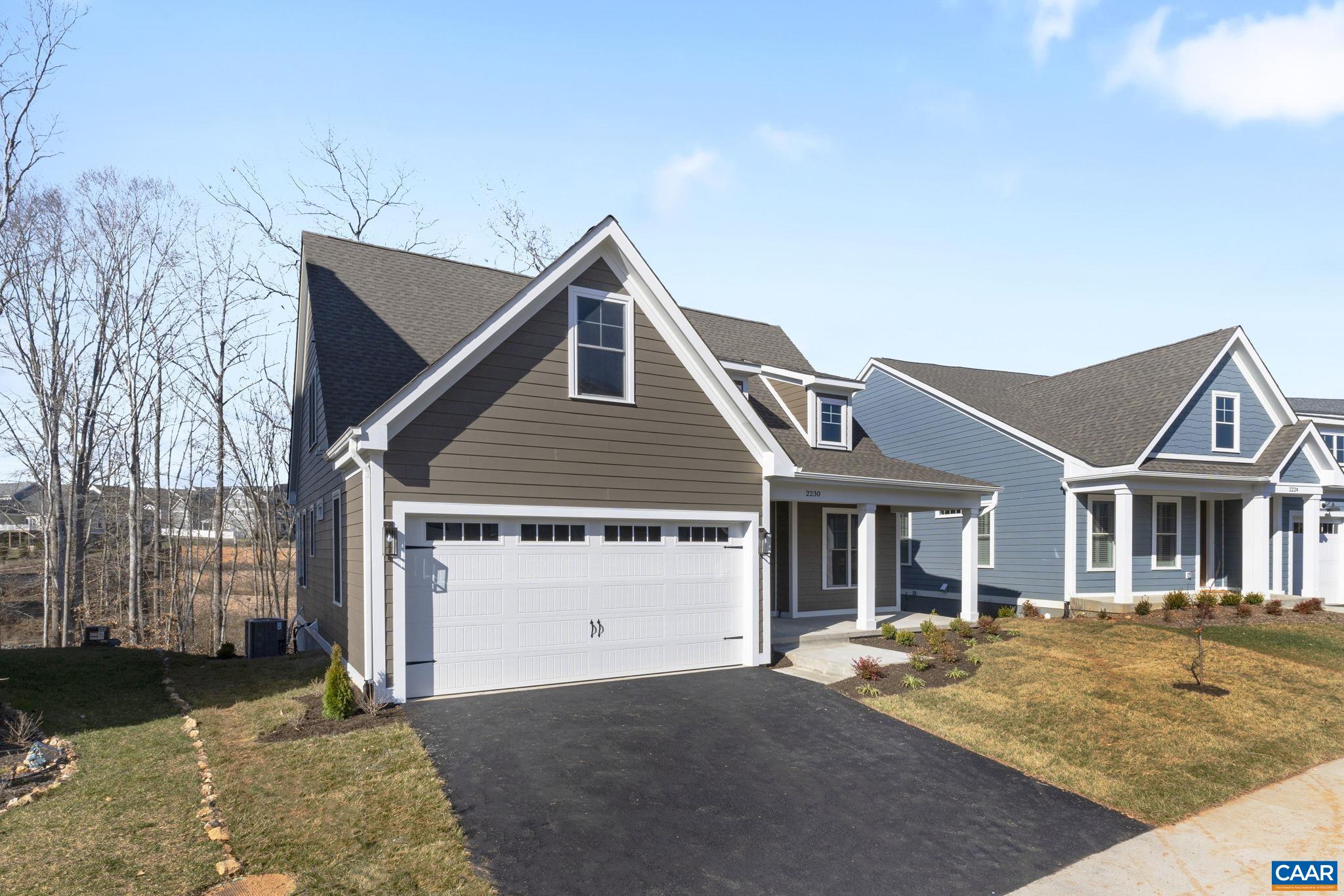 2230 Fowler Circle Charlottesville, VA 22901 - Photo 2 of 58 a front view of a house with a yard