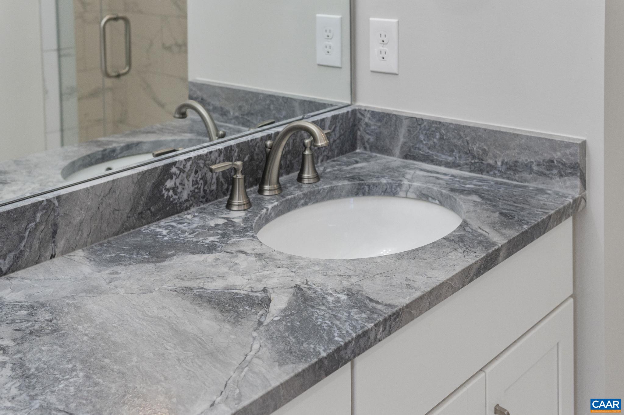 2230 Fowler Circle Charlottesville, VA 22901 - Photo 39 of 58 a bathroom with a granite countertop sink and a mirror
