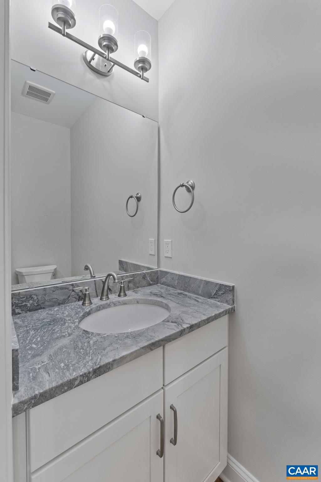 2230 Fowler Circle Charlottesville, VA 22901 - Photo 46 of 58 a bathroom with a granite countertop sink and vanity