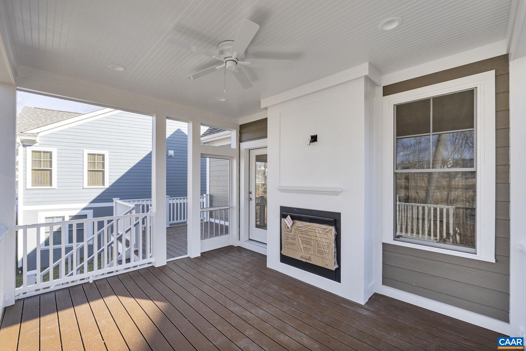 2230 Fowler Circle Charlottesville, VA 22901 - Photo 7 of 58 a view of an empty room with wooden floor fireplace and a window