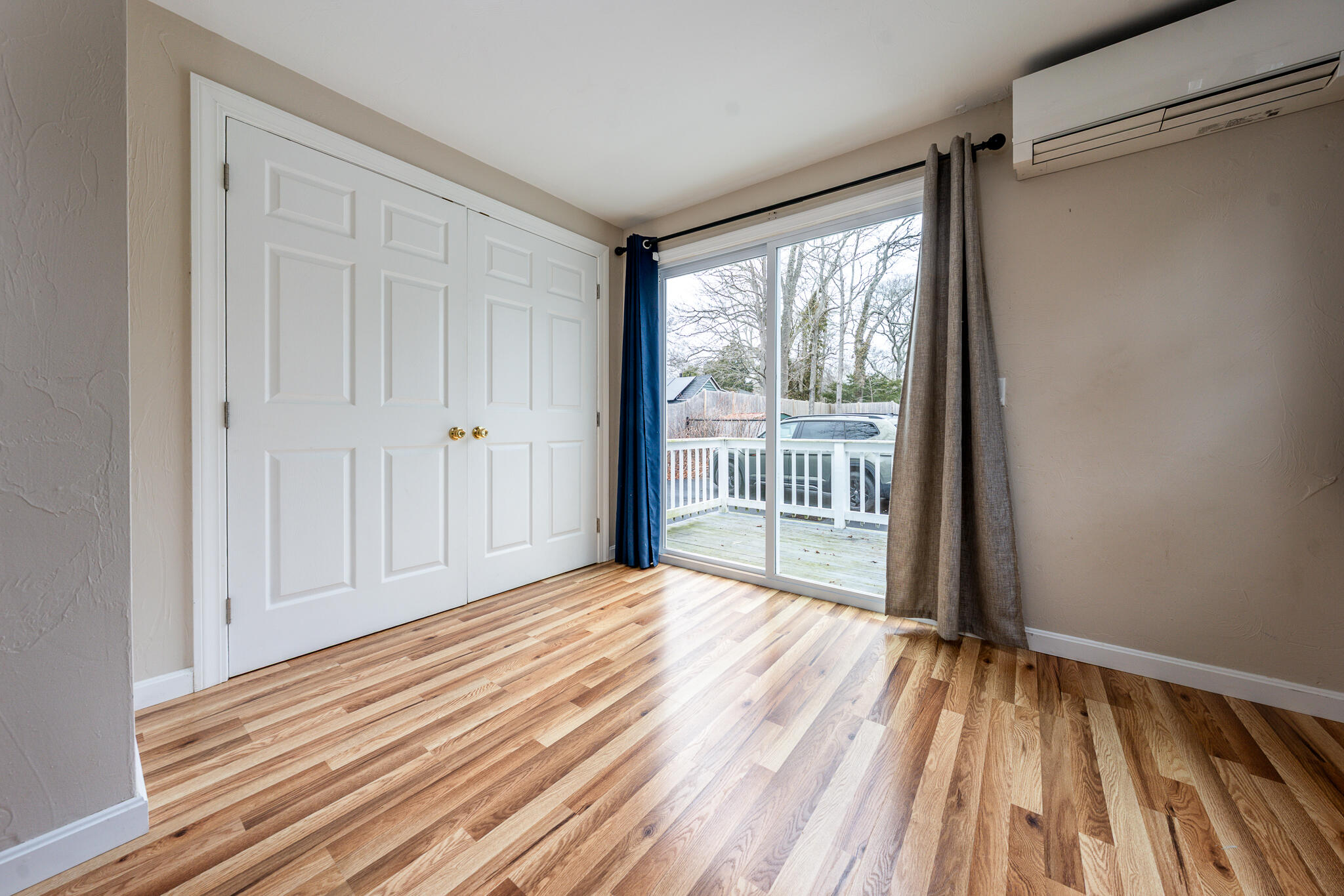 84 Bearses Way Hyannis, MA 02601 - Photo 11 of 36 a view of empty room with wooden floor and fan