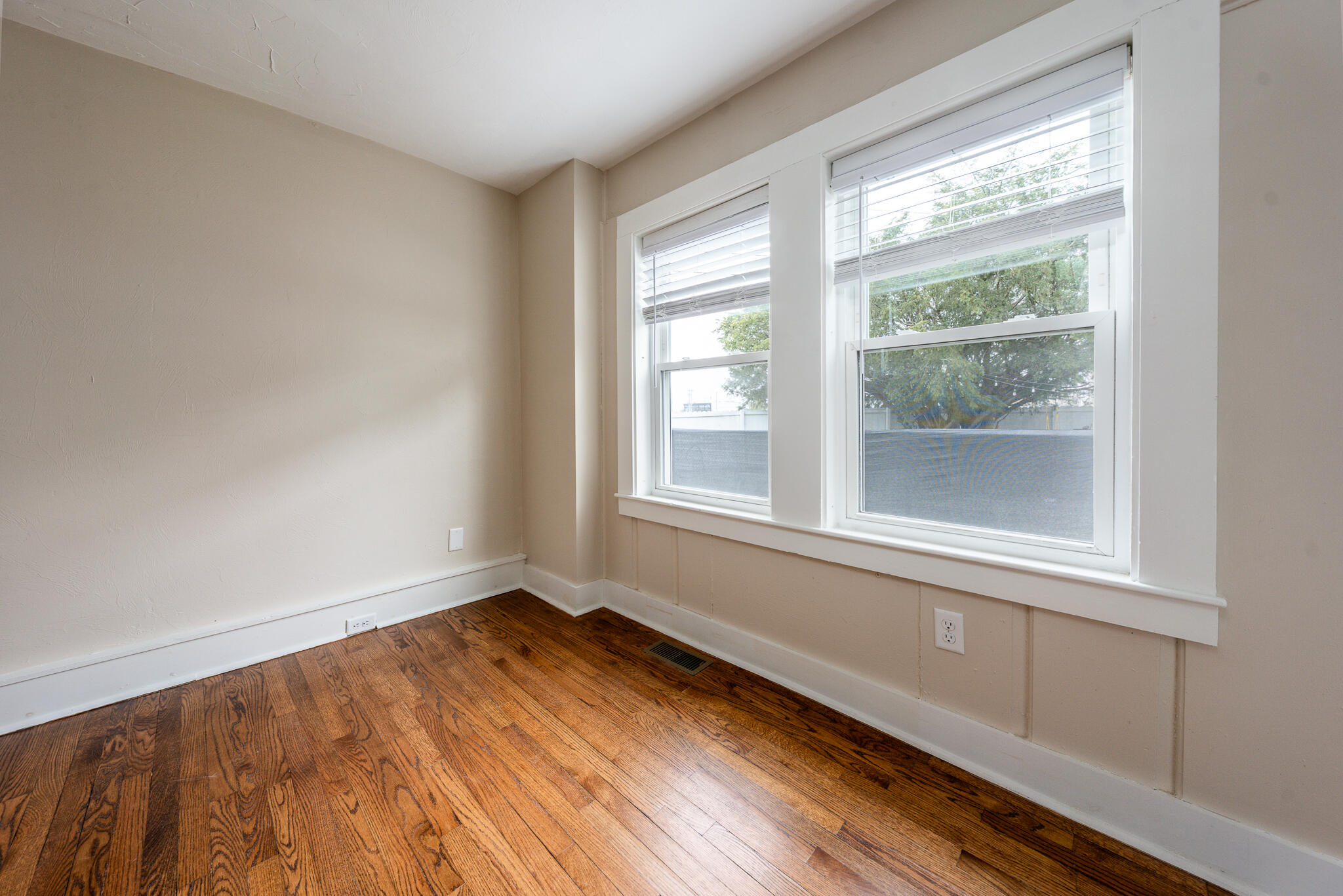 84 Bearses Way Hyannis, MA 02601 - Photo 13 of 36 a view of an empty room with wooden floor and a window