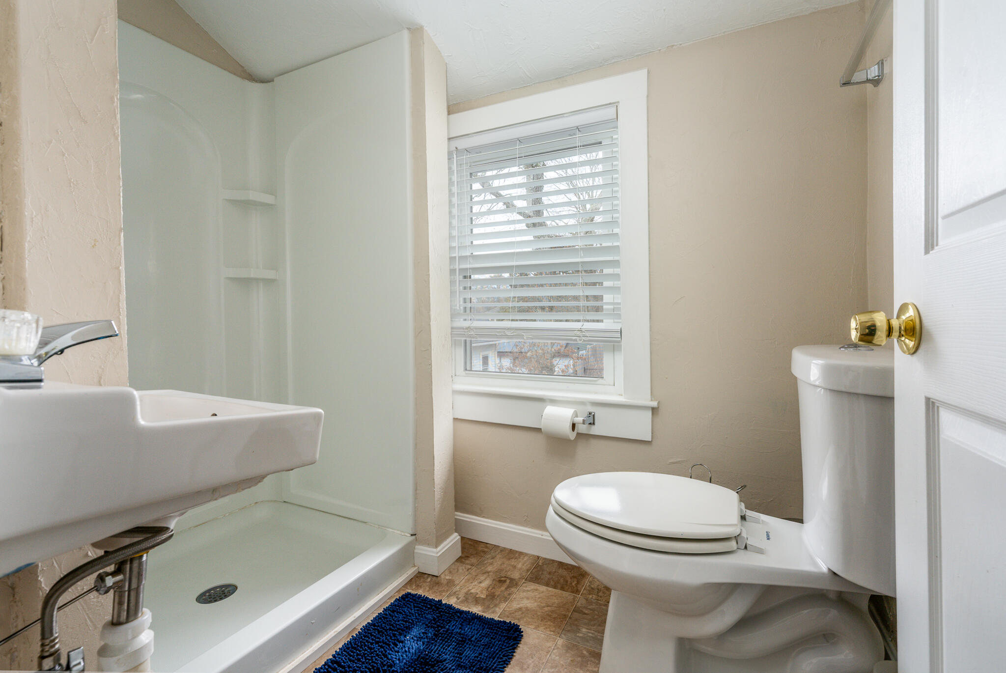 84 Bearses Way Hyannis, MA 02601 - Photo 15 of 36 a bathroom with a sink a toilet and shower