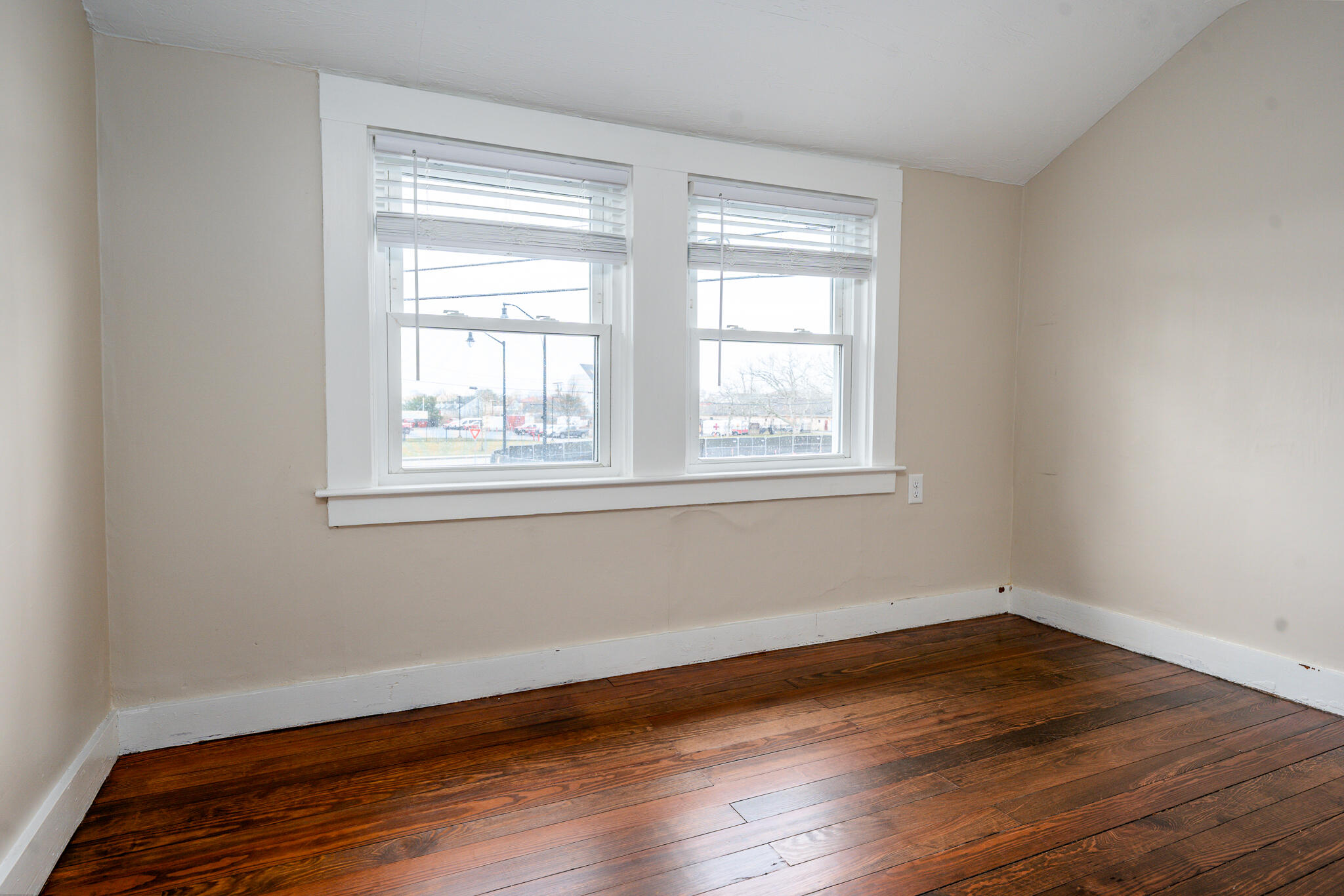 84 Bearses Way Hyannis, MA 02601 - Photo 16 of 36 a view of a room with wooden floor and windows in it
