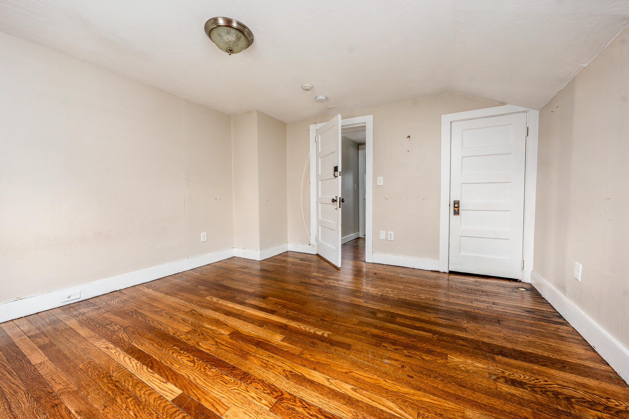 84 Bearses Way Hyannis, MA 02601 - Photo 21 of 36 a view of empty room with wooden floor