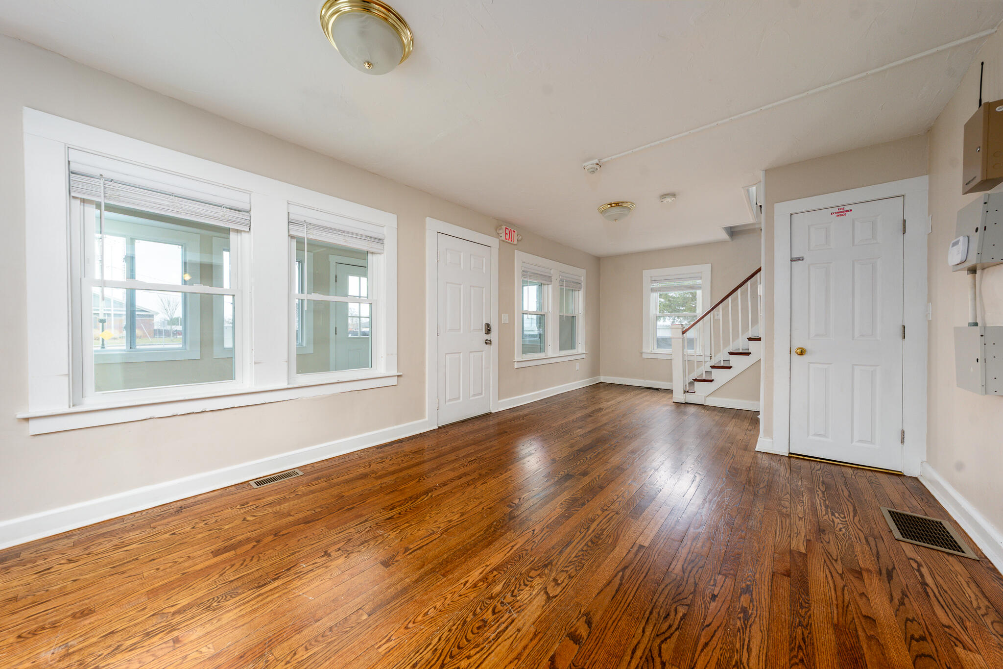 84 Bearses Way Hyannis, MA 02601 - Photo 3 of 36 a view of empty room with wooden floor and fan