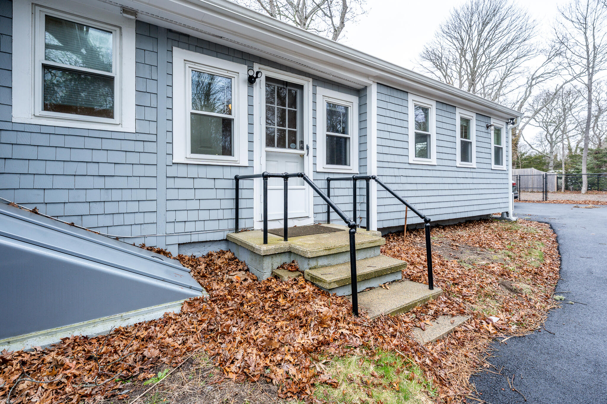 84 Bearses Way Hyannis, MA 02601 - Photo 33 of 36 a view of a house with backyard and wooden fence