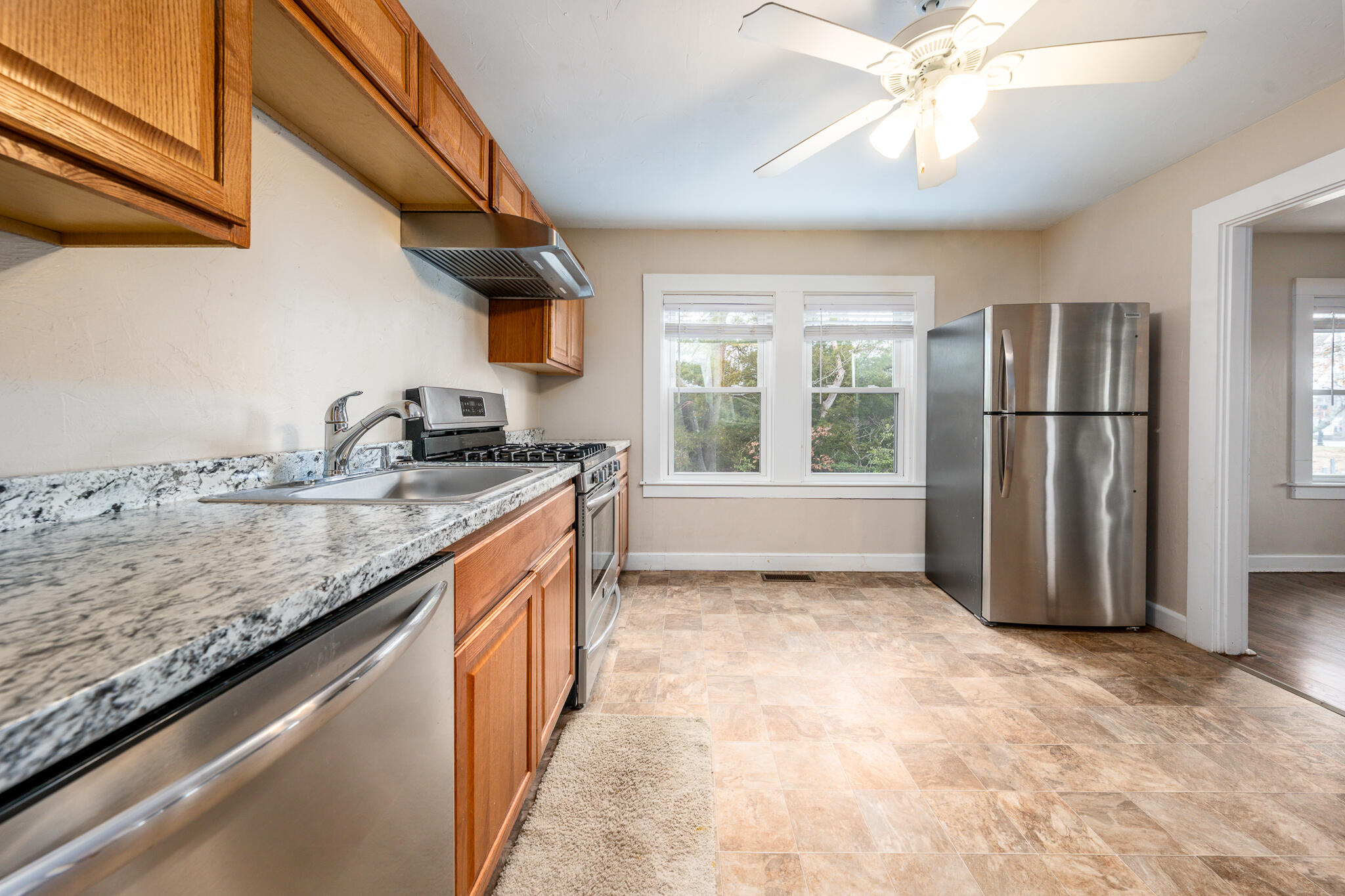 84 Bearses Way Hyannis, MA 02601 - Photo 5 of 36 a kitchen with granite countertop stainless steel appliances a sink stove and refrigerator