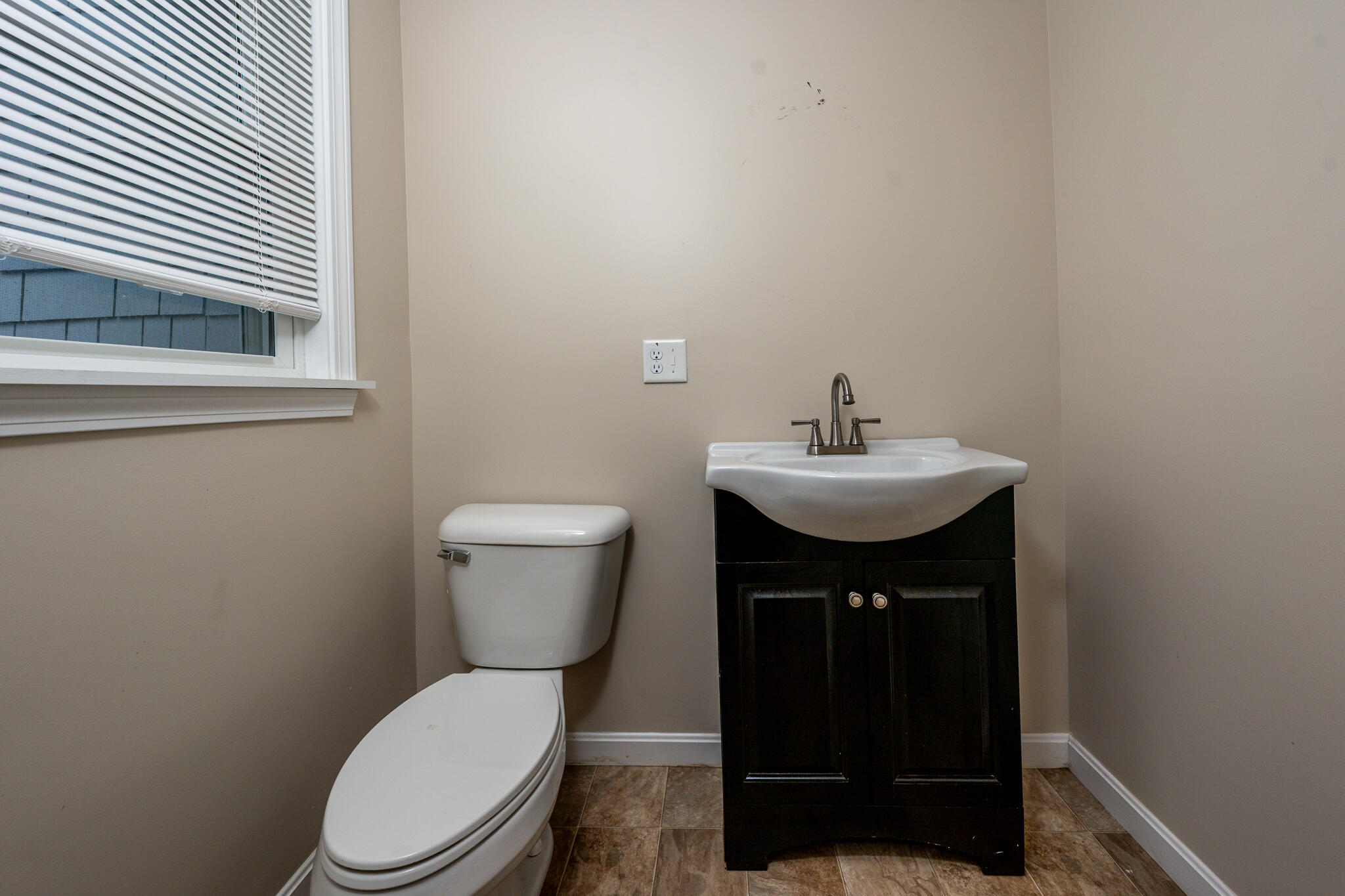 84 Bearses Way Hyannis, MA 02601 - Photo 9 of 36 a bathroom with a sink toilet and a mirror