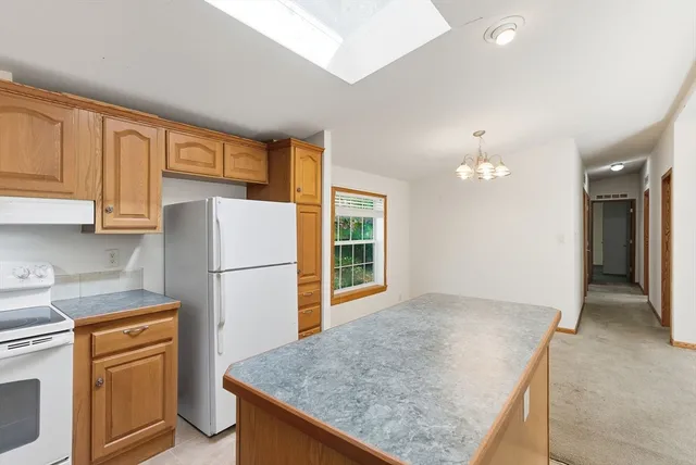a view of bathroom with a shower and a view of bathroom