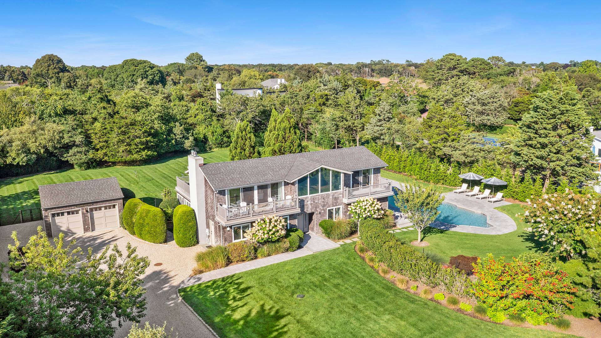 an aerial view of a house with a garden