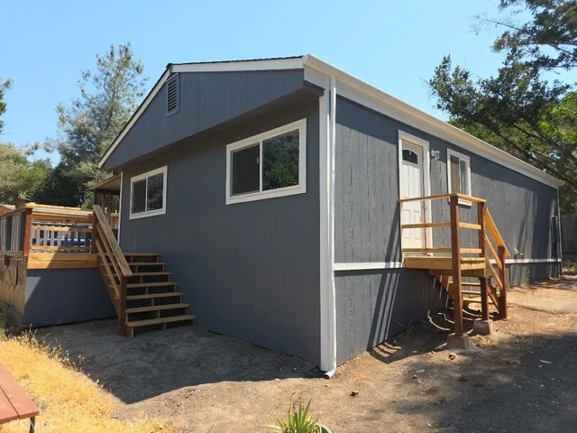 a front view of a house with stairs