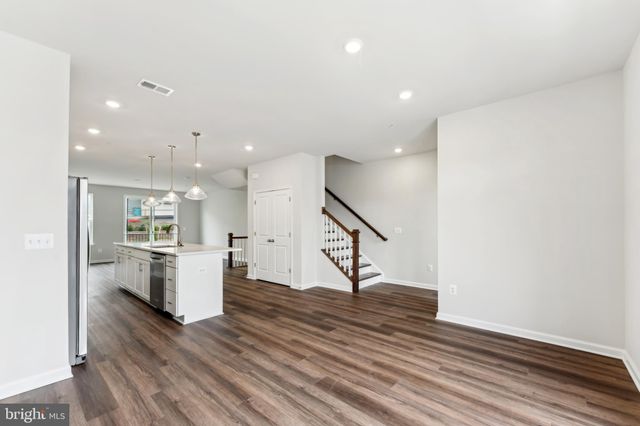 a view of kitchen with furniture and wooden floor