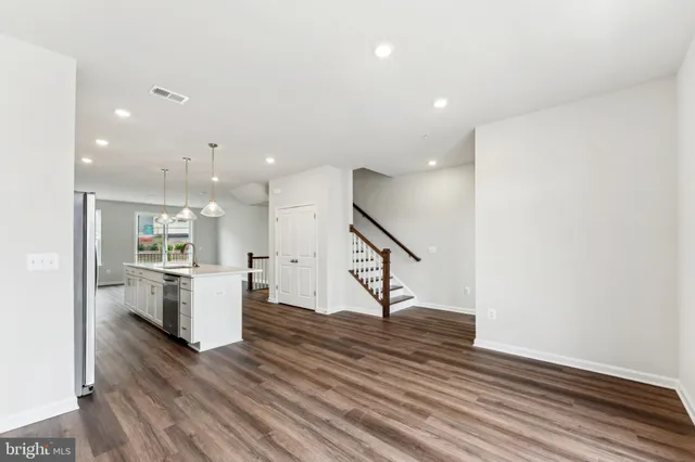 a view of kitchen with furniture and wooden floor