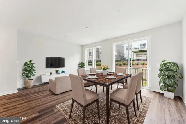 a view of a livingroom with furniture and a window