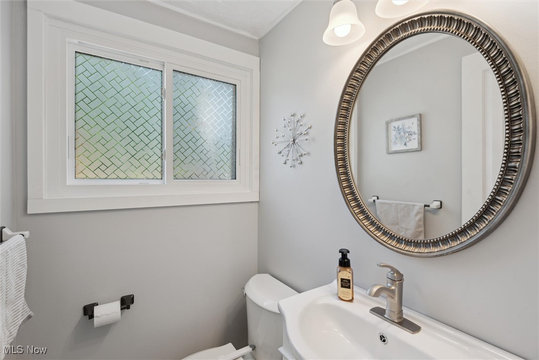 8191 Edgewood Road Mentor, OH 44060 - Photo 18 of 44 Convenient and updated first-floor half bath with modern finishes—perfectly located for guests and everyday use