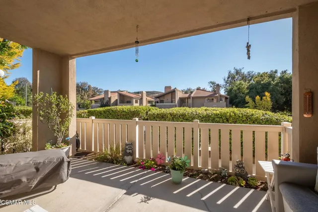 a view of a balcony with chairs