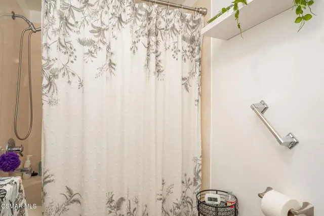 a bathroom with a shower curtain