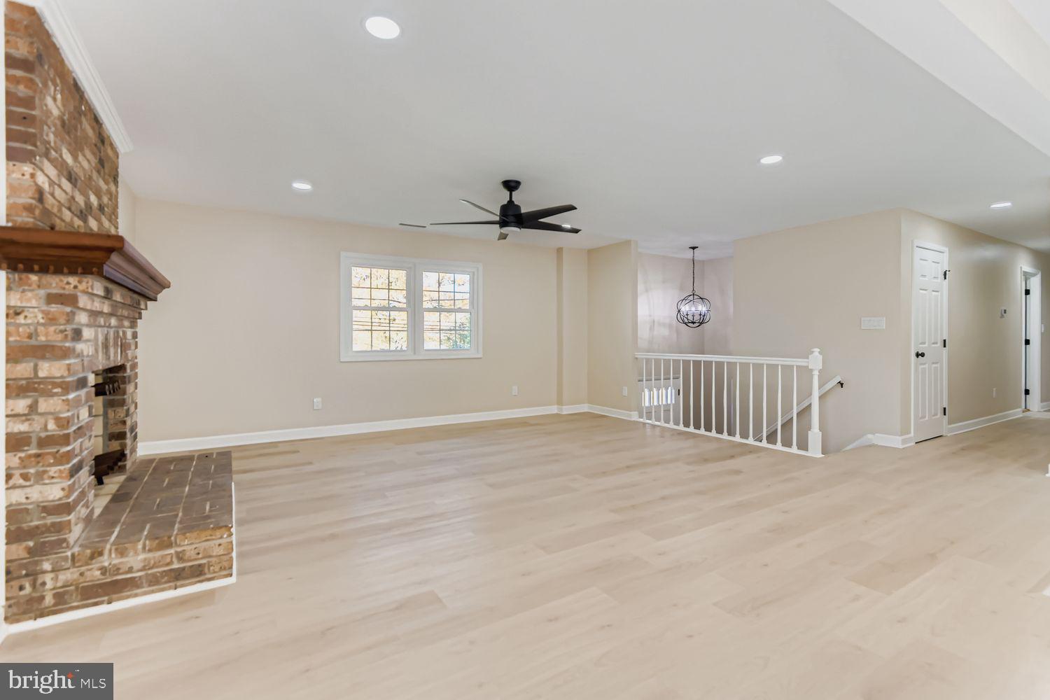 719 South Marlyn Avenue Baltimore, MD 21221 - Photo 14 of 39 an empty room with windows and ceiling fan