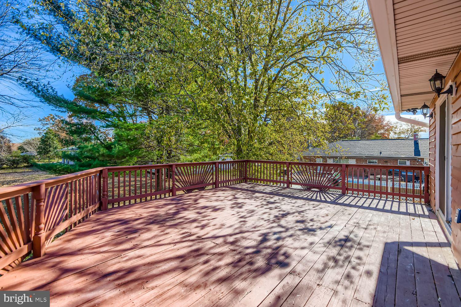 719 South Marlyn Avenue Baltimore, MD 21221 - Photo 10 of 39 a view of balcony with wooden floor and fence