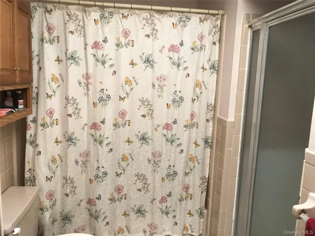 a bathroom with a shower curtain