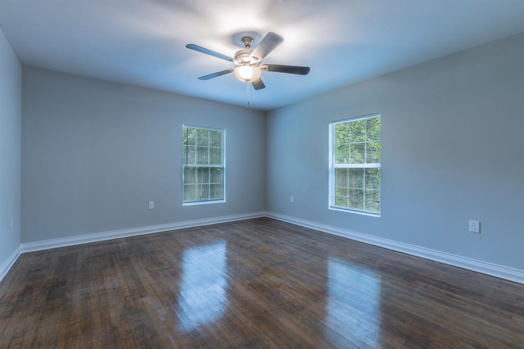 2816 Summer Avenue Waco, TX 76708 - Photo 11 of 16 a view of an empty room with wooden floor and a window