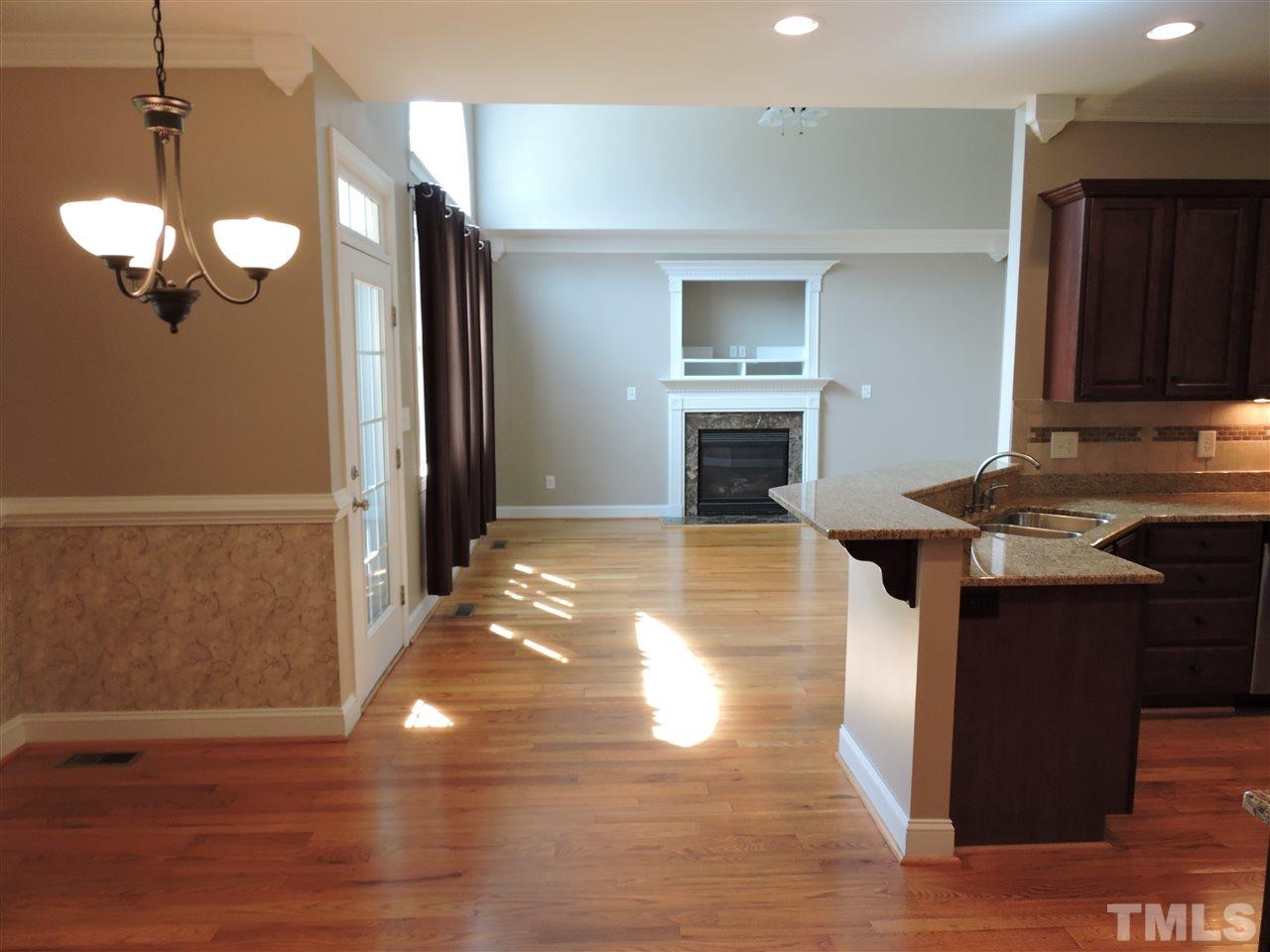 223 Fletcher Ridge Road Timberlake, NC 27583 - Photo 11 of 24 a view of kitchen with granite countertop cabinets and refrigerator