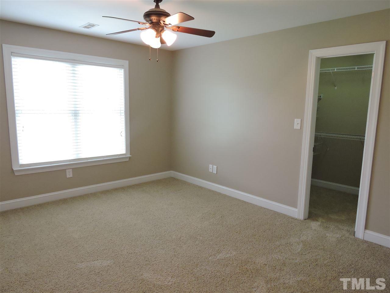 223 Fletcher Ridge Road Timberlake, NC 27583 - Photo 18 of 24 an empty room with a window