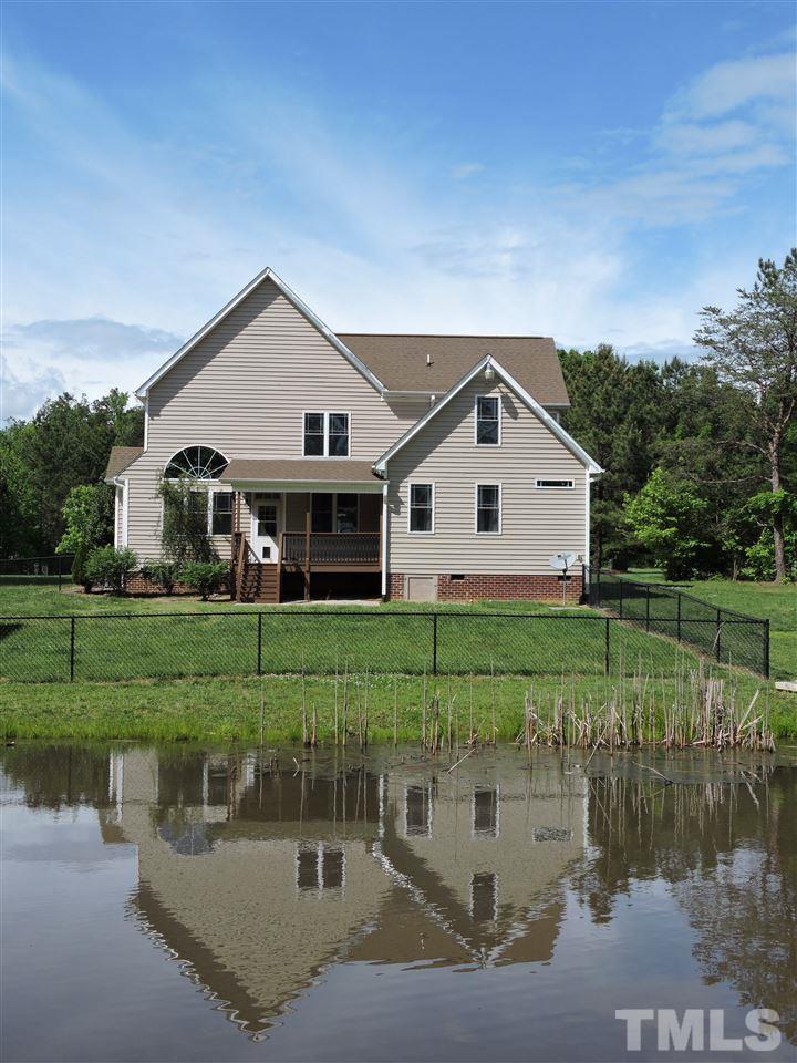 223 Fletcher Ridge Road Timberlake, NC 27583 - Photo 24 of 24 a front view of a house with a yard