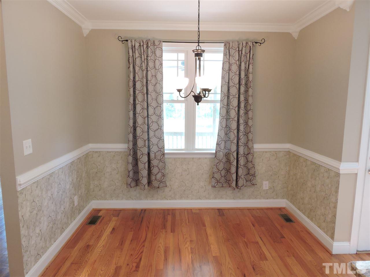 223 Fletcher Ridge Road Timberlake, NC 27583 - Photo 6 of 24 a view of empty room with wooden floor and fan