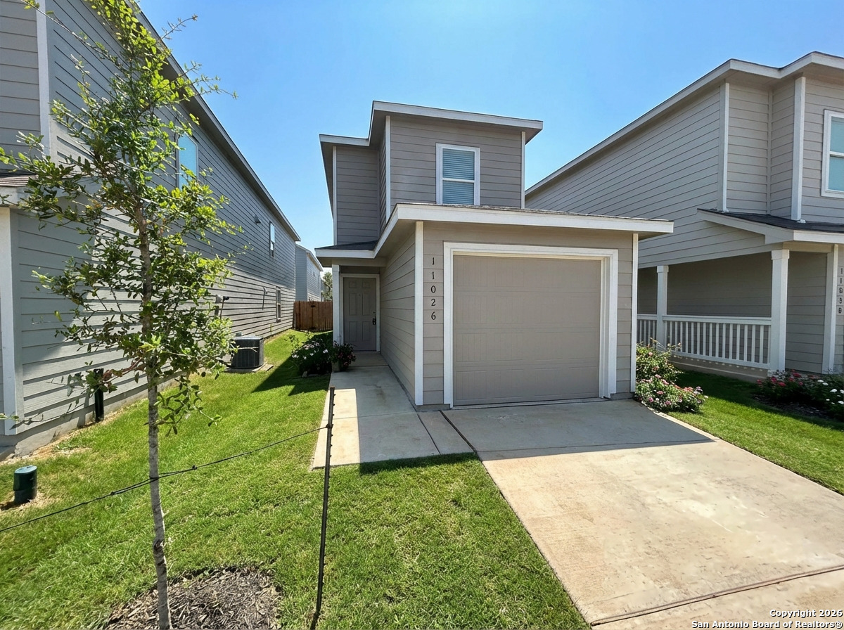 a view of a back yard of the house