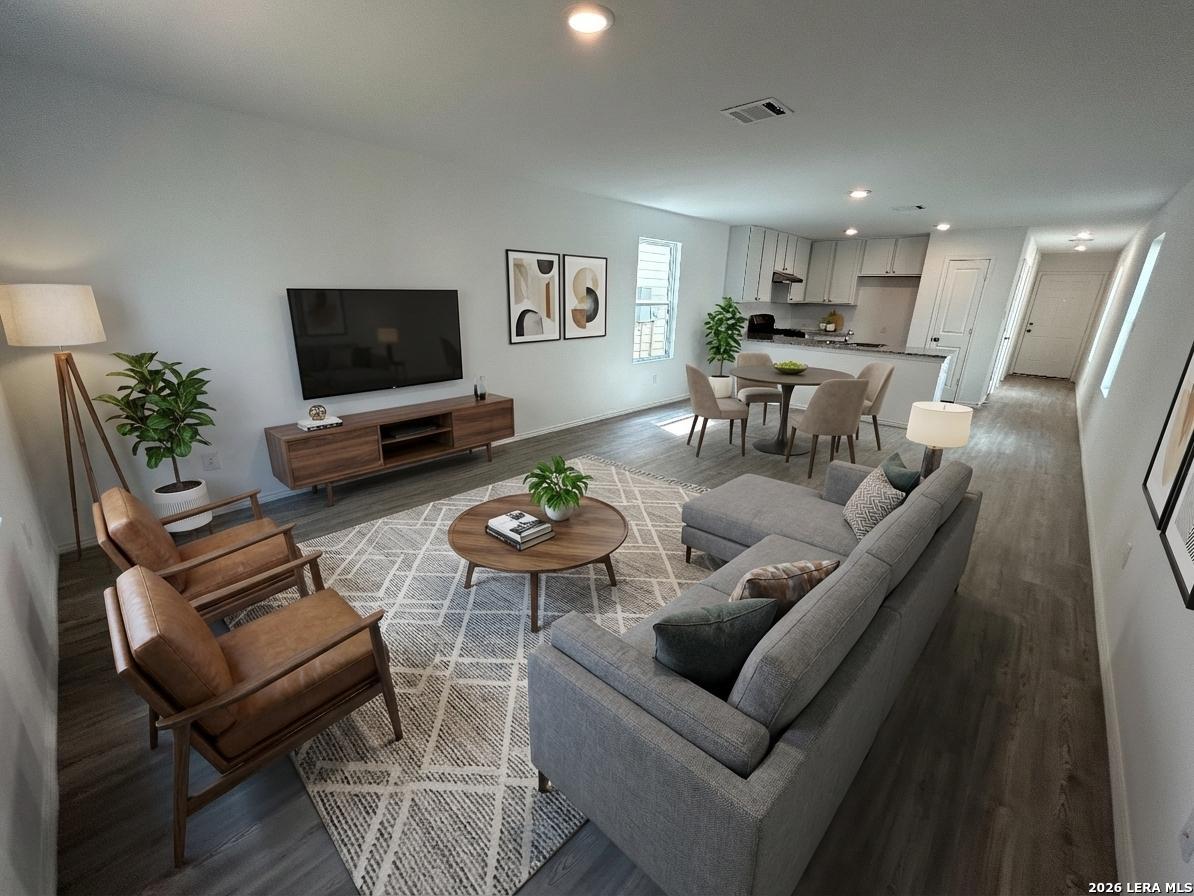 11026 Tree Line San Antonio, TX 78223 - Photo 11 of 31 a living room with furniture and a flat screen tv