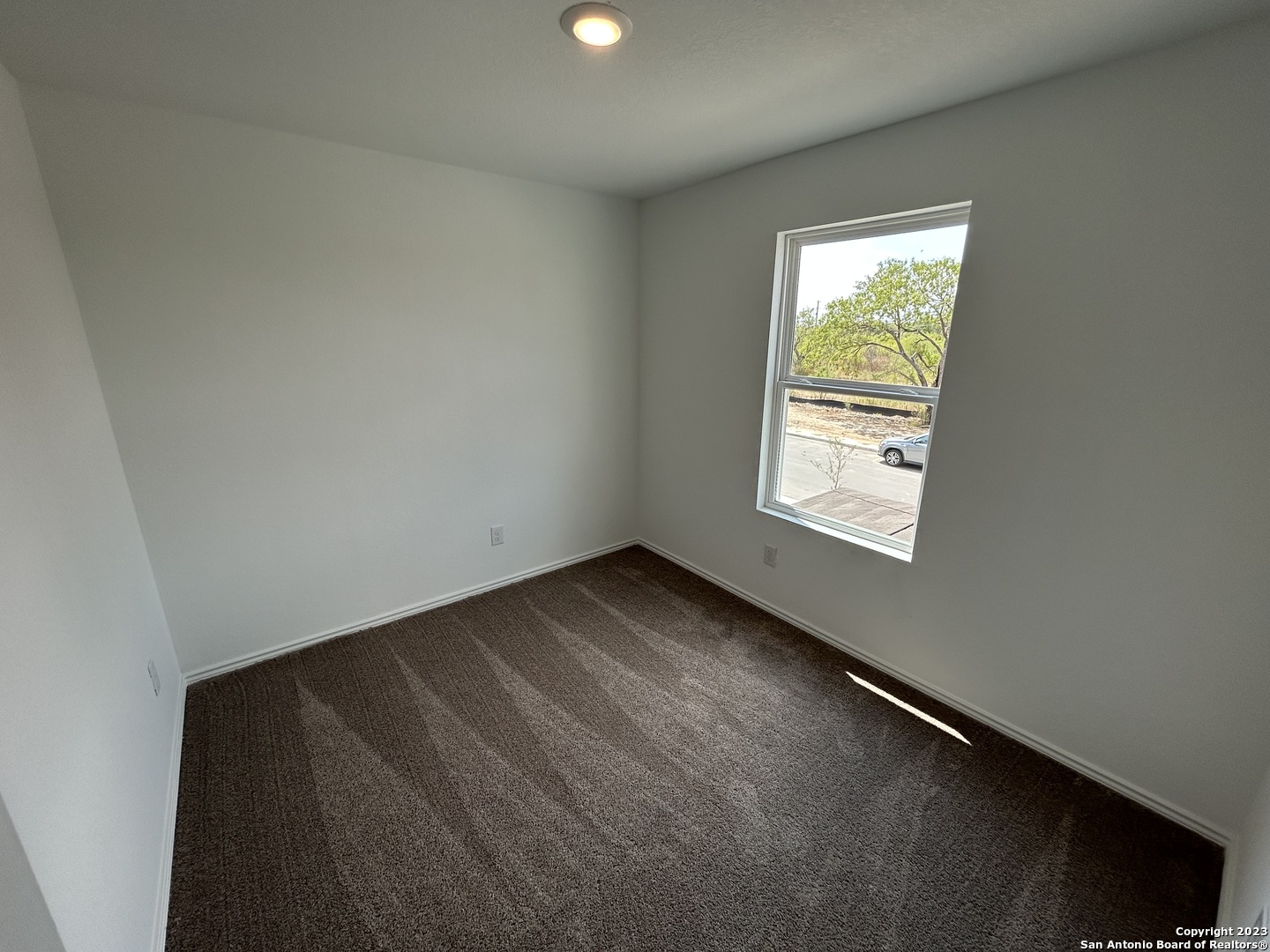 11026 Tree Line San Antonio, TX 78223 - Photo 21 of 31 an empty room with windows