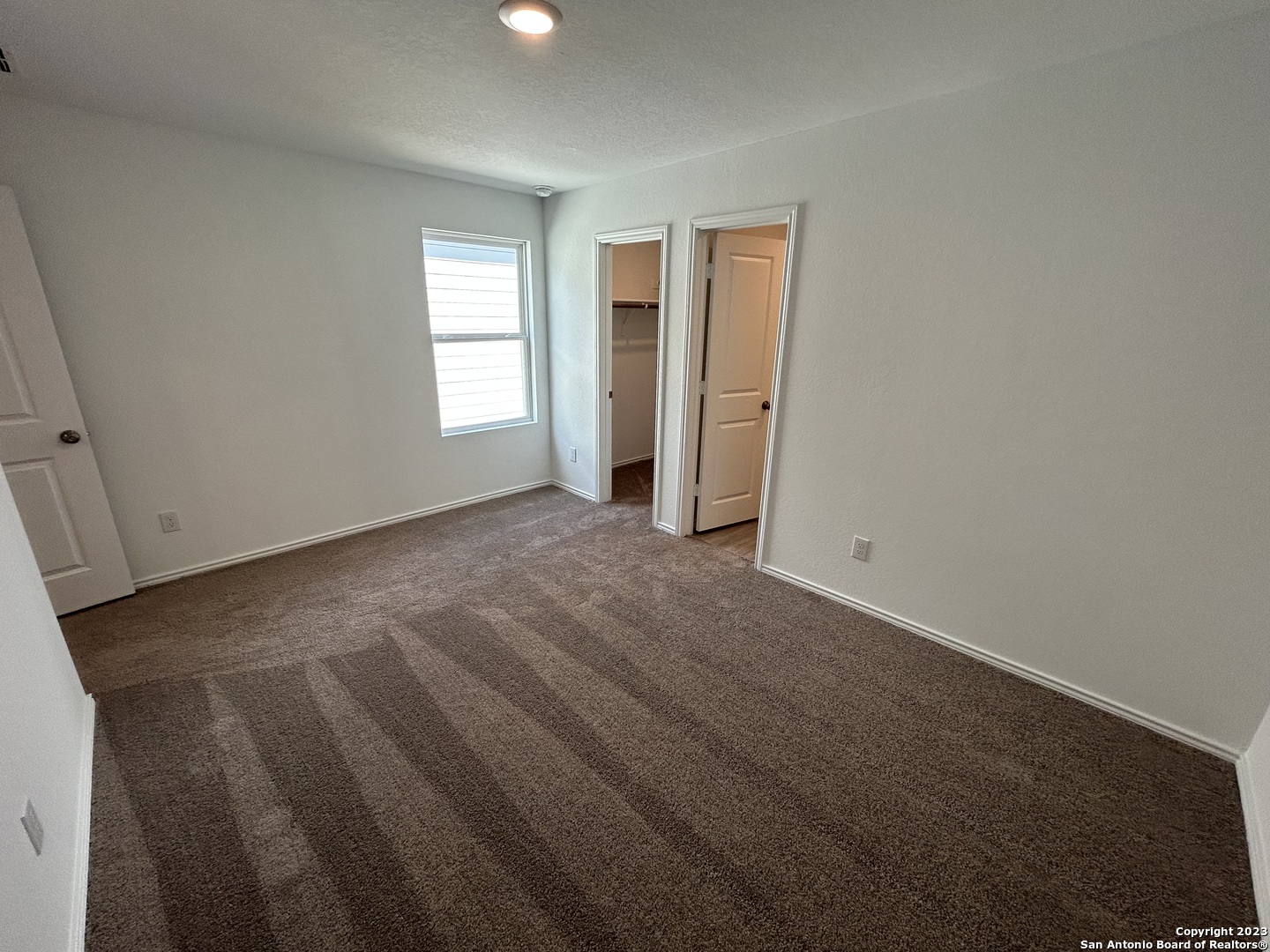 11026 Tree Line San Antonio, TX 78223 - Photo 24 of 31 an empty room with windows