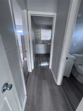 a view of a hallway view with wooden floor and staircase