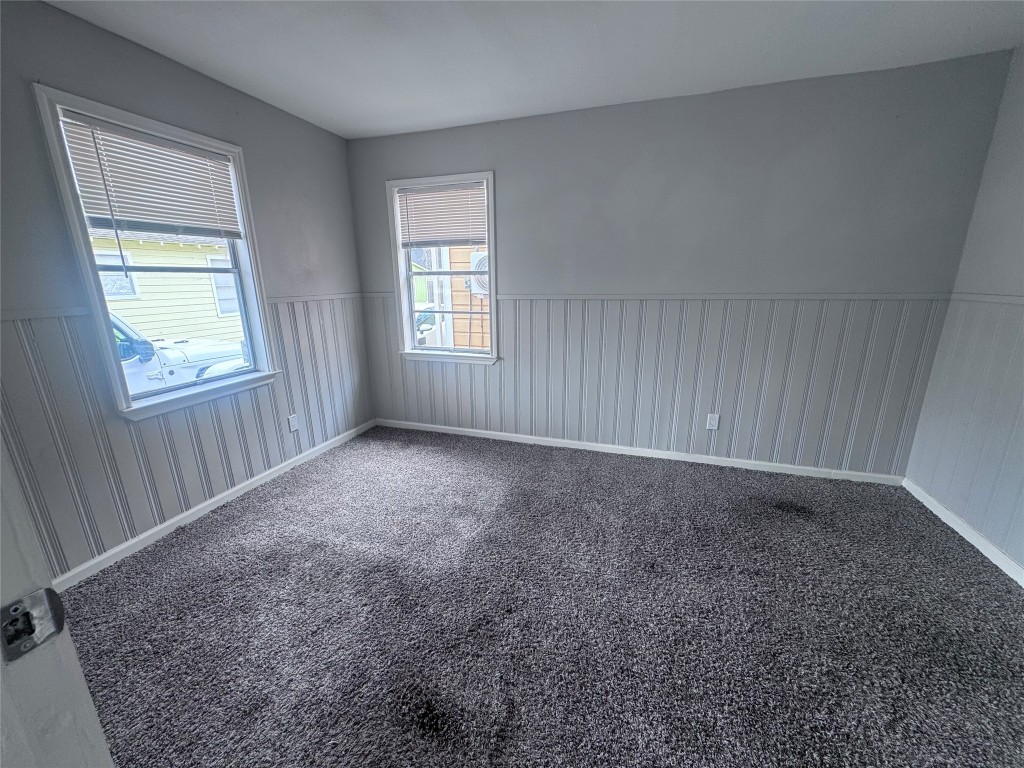 1306 Weiss Street Houston, TX 77009 - Photo 7 of 10 an empty room with windows