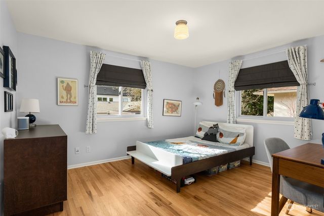 a bedroom with a bed and a desk