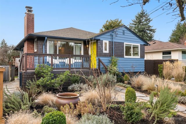 a backyard of a house with yard and outdoor seating