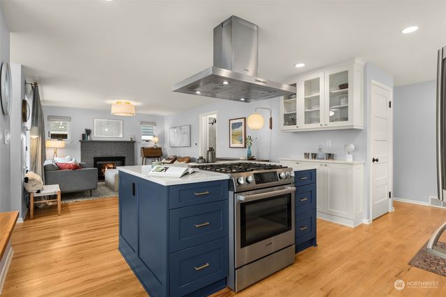a kitchen with a stove and a sink