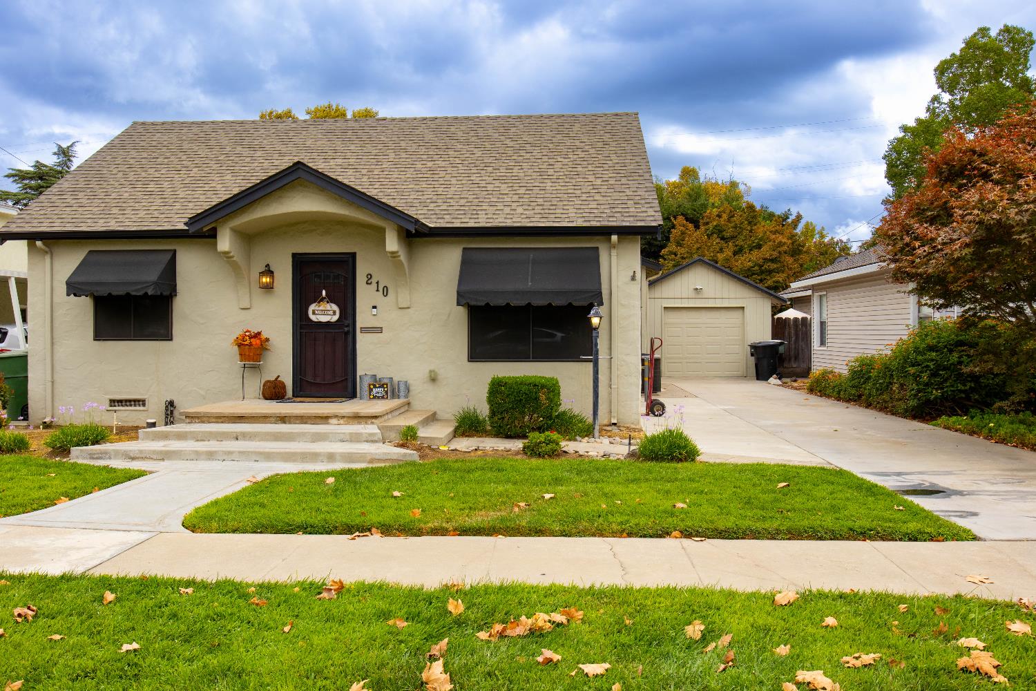 210 Palm Avenue Ripon, CA 95366 - Photo 1 of 1 a front view of a house with a yard and garage