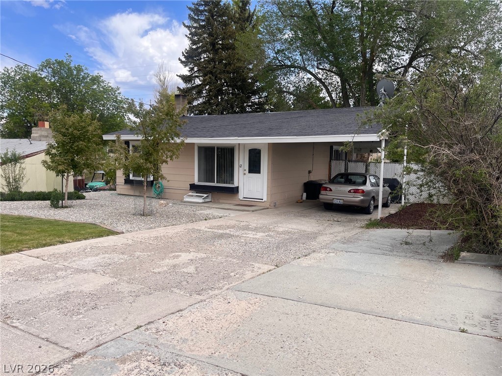 12 Reno Road Ely, NV 89301 - Photo 1 of 21 Single story home featuring concrete driveway and a carport