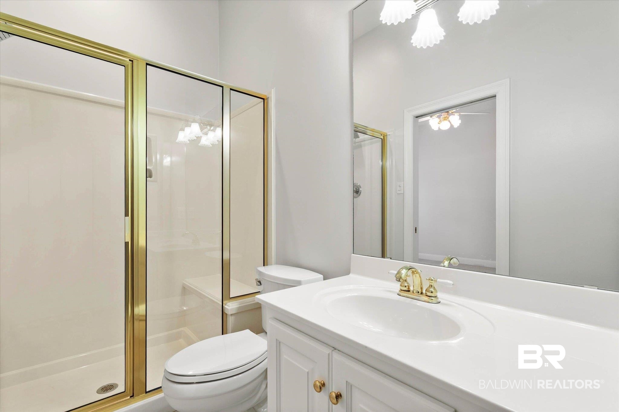 1083 Southern Way Court Mobile, AL 36609 - Photo 24 of 31 Bathroom featuring vanity, a stall shower, and suspended lighting