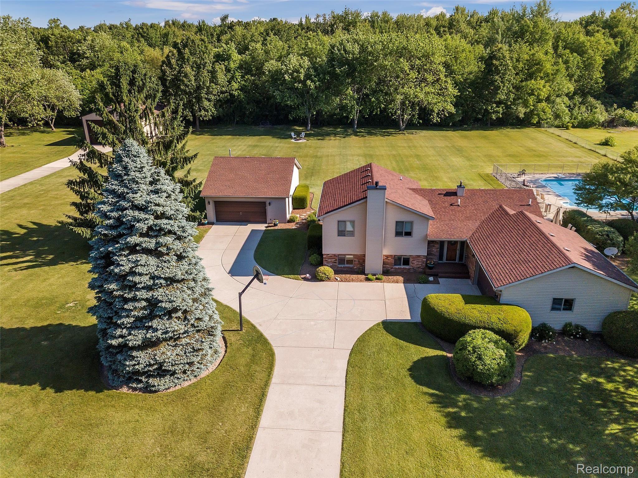 4054 Bennett Lake Road Fenton, MI 48430 - Photo 1 of 57 Meticulously Maintained Quad Level on 2.60 Acres off Paved Rd w/ 2nd Detached Garage, 30x48 Pole Barn & Heated Inground Pool
