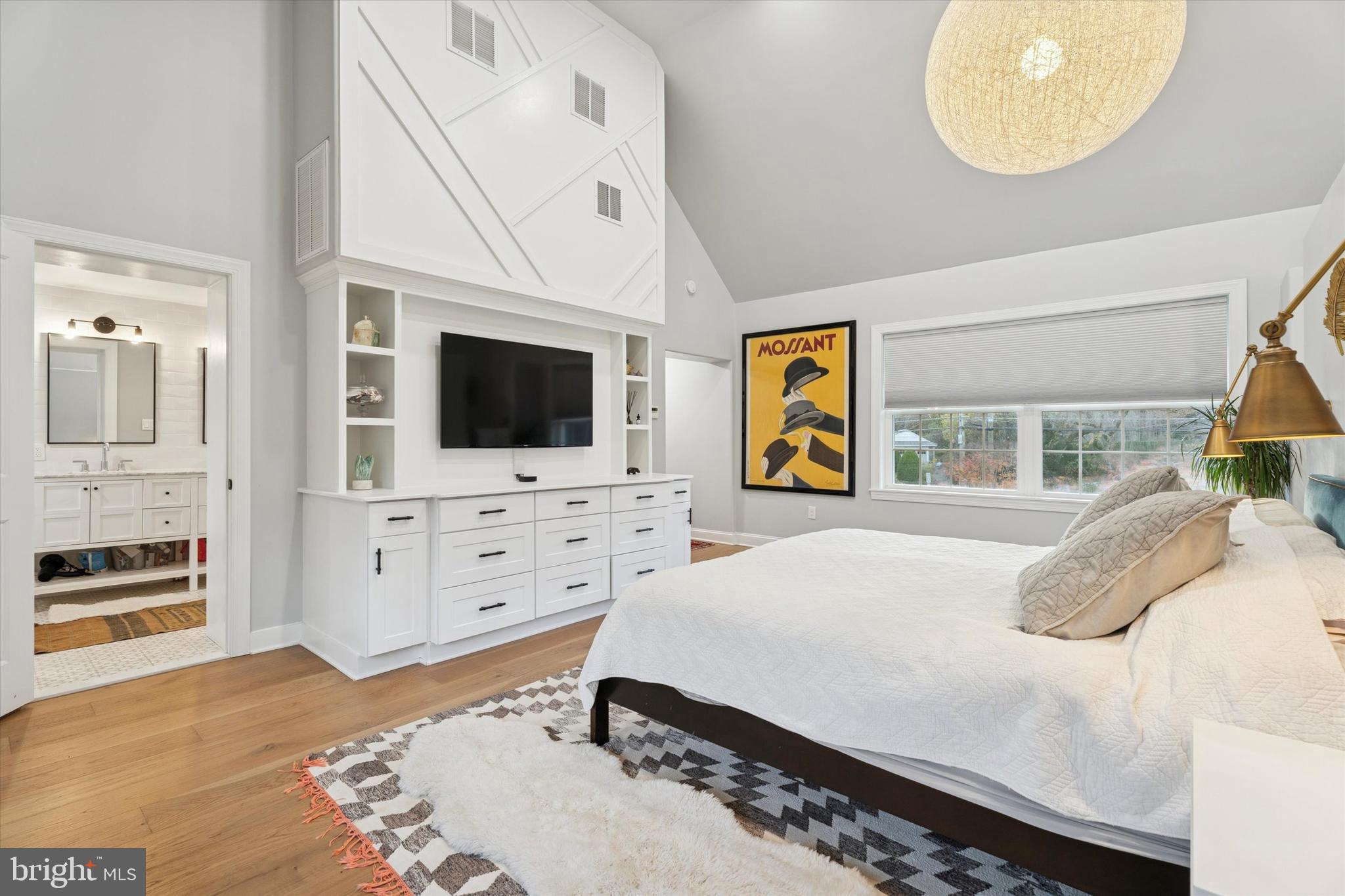 603 Old Gulph Road Penn Valley, PA 19072 - Photo 12 of 58 a bedroom with a bed and a flat tv screen on dresser