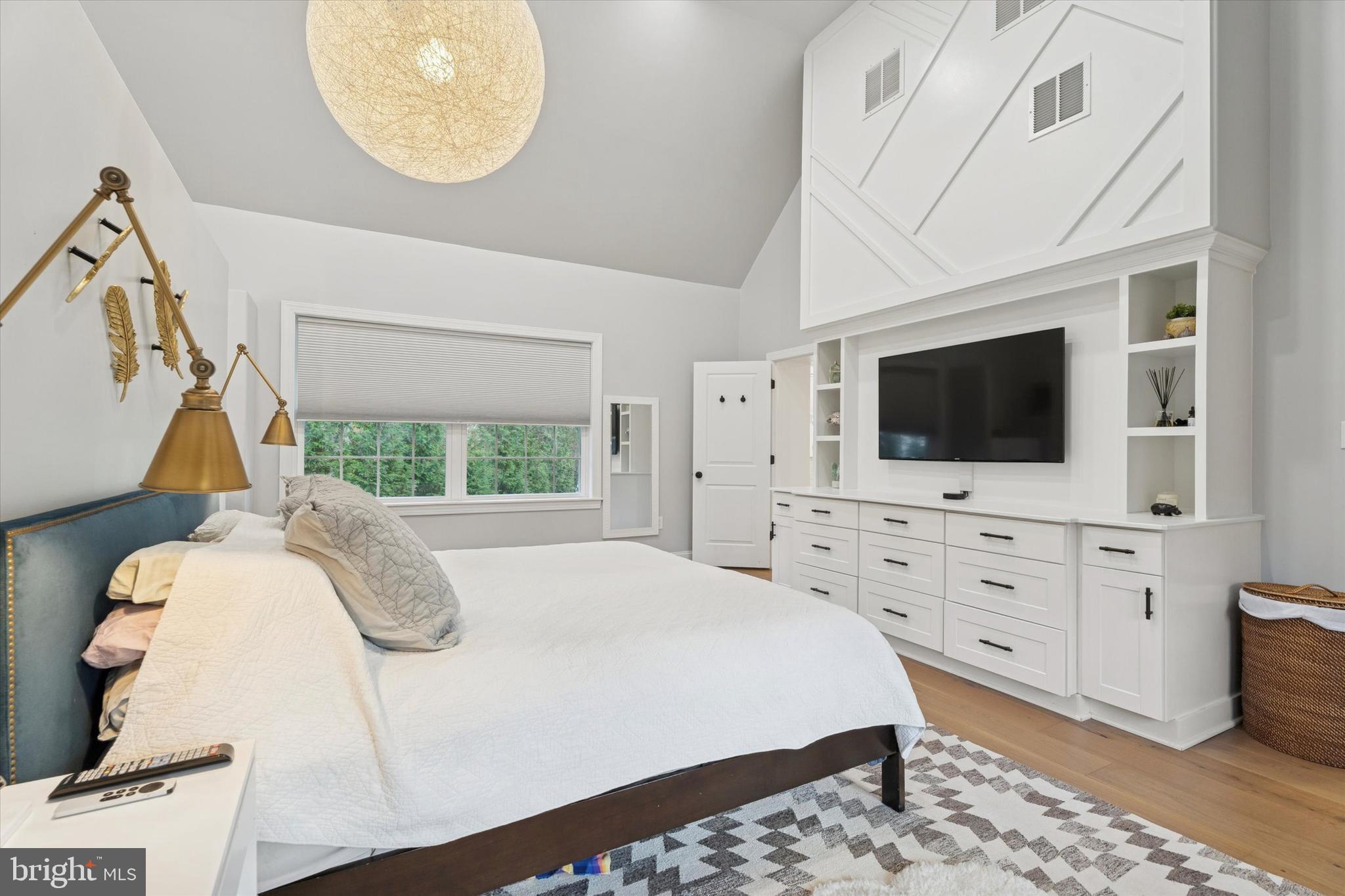 603 Old Gulph Road Penn Valley, PA 19072 - Photo 13 of 58 a living room with a flat screen tv a rug and white walls
