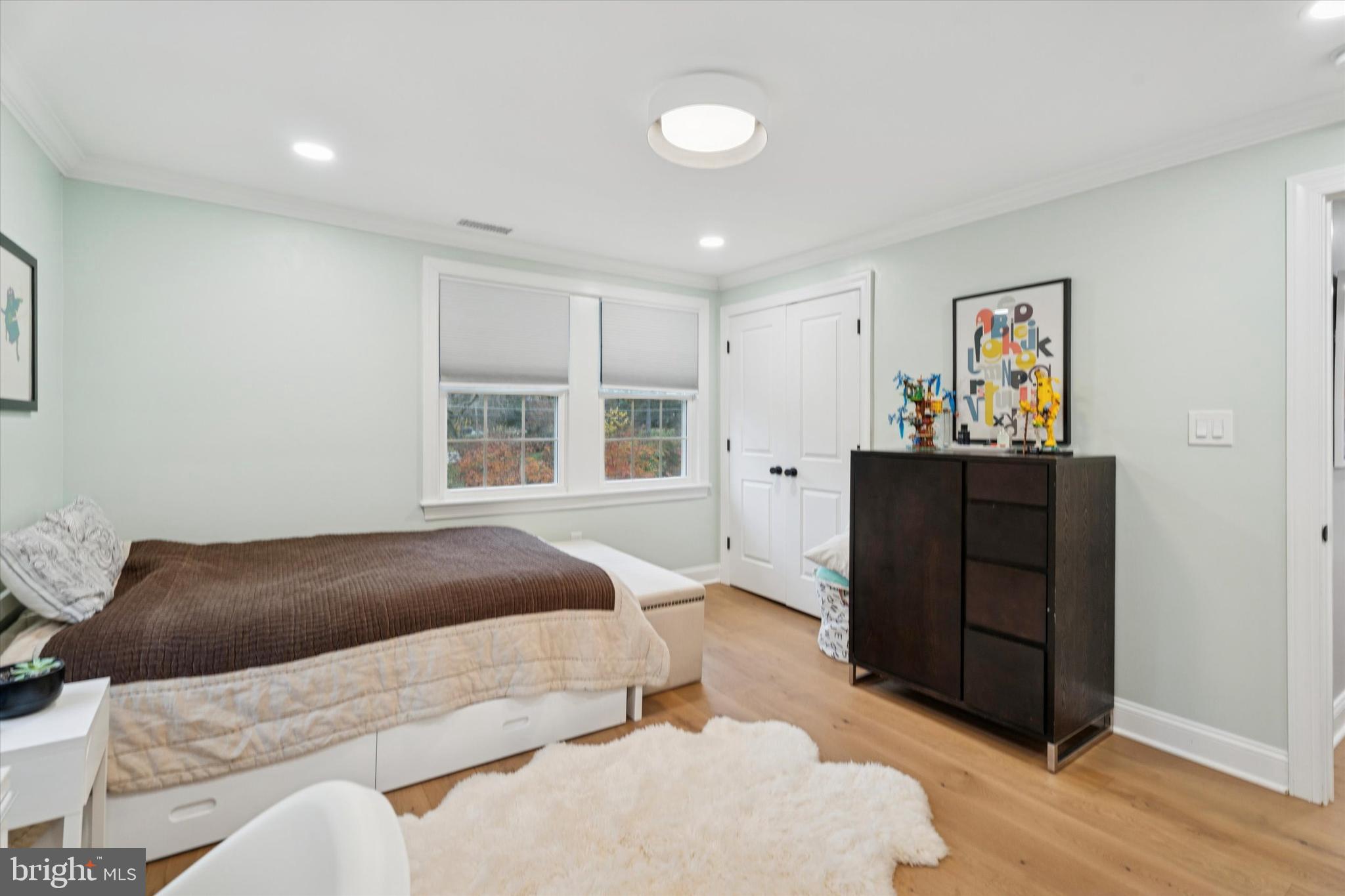 603 Old Gulph Road Penn Valley, PA 19072 - Photo 21 of 58 a bedroom with a bed and wooden floor