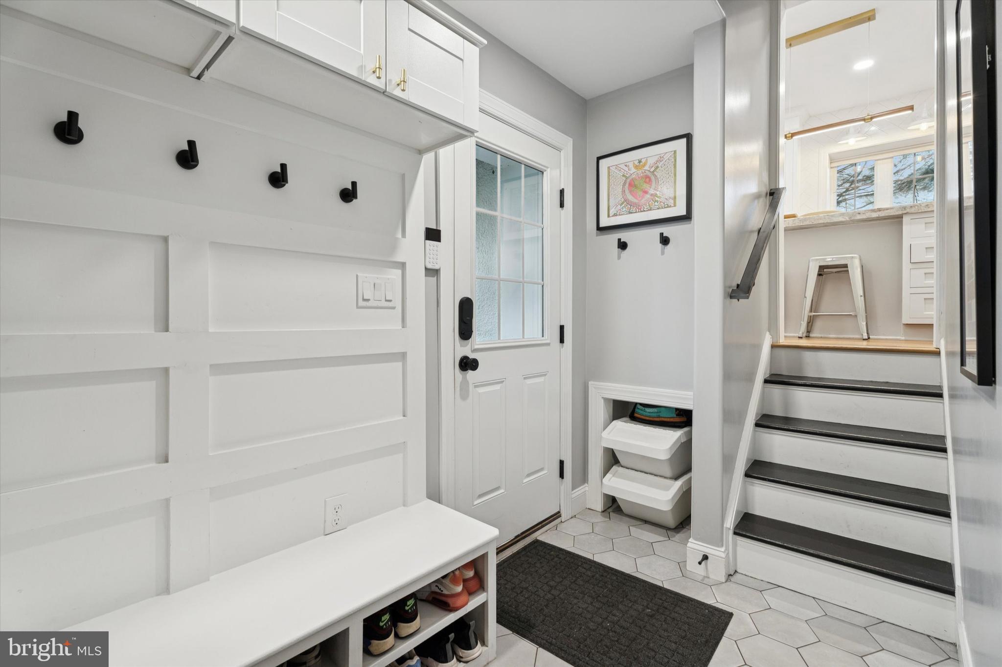 603 Old Gulph Road Penn Valley, PA 19072 - Photo 30 of 58 a view of a hallway with wooden floor and staircase